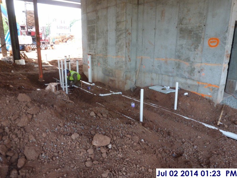 Installing underground sanitary piping at Room 105 (Servery) Facing North-West (800x600)